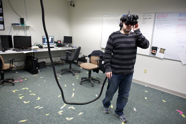Third-year master's student Chris Bennett walks around with a virtual reality headset at the Virtual Environment and Multimodal Interaction Laboratory at the University of Maine in Orono on Friday, Feb. 8, 2013. Students and researchers at the lab have been working on virtual reality programs to help the visually impaired, firefighters in smoke-filled rooms, and others "see" buildings through augmented reality. Third-year master's student Chris Bennett walks around with a virtual reality headset at the Virtual Environment and Multimodal Interaction Laboratory at the University of Maine in Orono on Friday, Feb. 8, 2013. Students and researchers at the lab have been working on virtual reality programs to help the visually impaired, firefighters in smoke-filled rooms, and others "see" buildings through augmented reality.