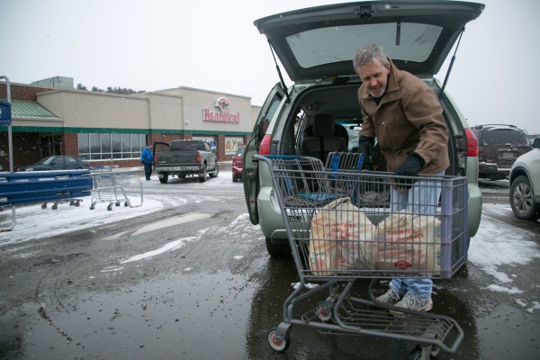 Jason Carlisle unloads groceries at the Hannaford grocery store on Broadway in Bangor on Feb. 8, 2013. Carlisle said he wasn't stocking up for the storm but thought it was good idea to get some shopping out of the way before it hit. Jason Carlisle unloads groceries at the Hannaford grocery store on Broadway in Bangor on Feb. 8, 2013. Carlisle said he wasn't stocking up for the storm but thought it was good idea to get some shopping out of the way before it hit.