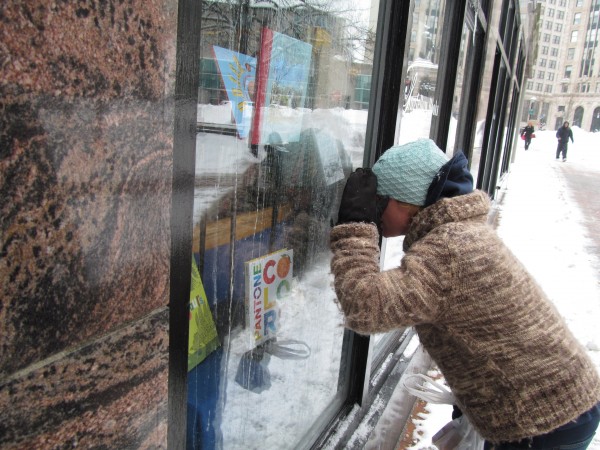 Alisa Yescas peers through the window of Longfellow Books on Monday, Feb. 11, 2013, in Portland. Yescas said she hopes the store, which closed due to water damage during Saturday's record-setting snowstorm, reopens soon. Alisa Yescas peers through the window of Longfellow Books on Monday, Feb. 11, 2013, in Portland. Yescas said she hopes the store, which closed due to water damage during Saturday's record-setting snowstorm, reopens soon.