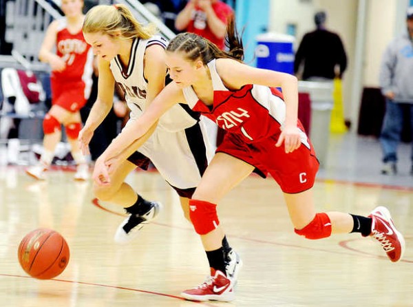 Ashlee Arnold (left) of Edward Little High School and Emily Quirion of Cony High School chase down a loose ball during the second period in Augusta on Friday. Ashlee Arnold (left) of Edward Little High School and Emily Quirion of Cony High School chase down a loose ball during the second period in Augusta on Friday.