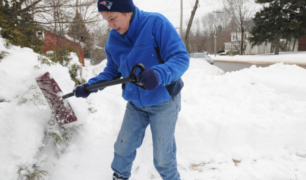 Julie Moore of Bangor shovels the walkway in front of a house her mother owns on Monday, Feb. 11, 2013. Moore said she moved back to Maine from Los Angeles a year and a half ago and she she jokingly said that at this point she is not happy about it. Although she did say it is pretty with the new show, the bare ground was looking rather sad. Julie Moore of Bangor shovels the walkway in front of a house her mother owns on Monday, Feb. 11, 2013. Moore said she moved back to Maine from Los Angeles a year and a half ago and she she jokingly said that at this point she is not happy about it. Although she did say it is pretty with the new show, the bare ground was looking rather sad.