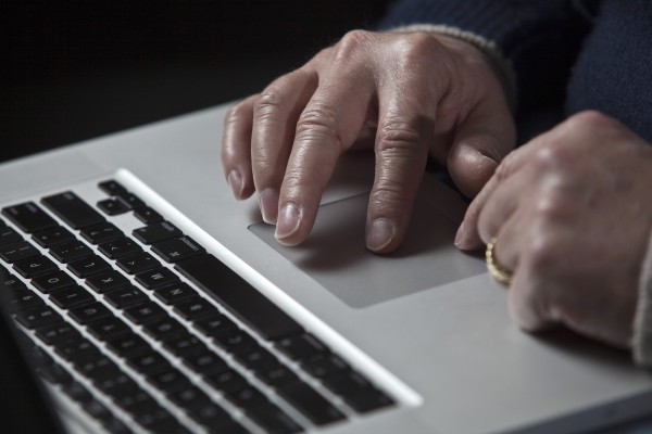 A cyber warfare expert works on his Apple laptop computer during a portrait session in Charlotte, N.C., in this 2011 file photograph. Apple Inc. was recently attacked by hackers who infected the Macintosh computers of some employees, the company said on Feb. 19, 2013, in an unprecedented disclosure that described the widest known cyber attacks against Apple-made computers to date. A cyber warfare expert works on his Apple laptop computer during a portrait session in Charlotte, N.C., in this 2011 file photograph. Apple Inc. was recently attacked by hackers who infected the Macintosh computers of some employees, the company said on Feb. 19, 2013, in an unprecedented disclosure that described the widest known cyber attacks against Apple-made computers to date.