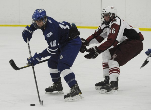 Lewiston's Kyle Lemelin and Bangor'sJustin Courtney chase down a puck during high school hockey action on Thursday at Sawyer Arena in Bangor. Lewiston's Kyle Lemelin and Bangor'sJustin Courtney chase down a puck during high school hockey action on Thursday at Sawyer Arena in Bangor.
