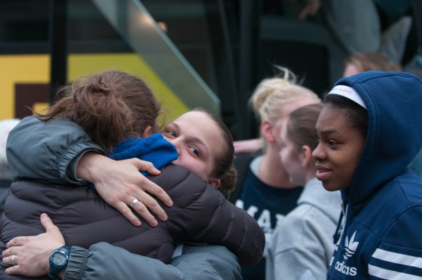 Rachele Burns, center, embraces Danielle Walczak while Chantel Charles, right, and other members of the University of Maine women's basketball team arrive back home to a crowd of family and friends on Wednesday, February 27, 2013. The bus the team was travelling on crashed Tuesday after the driver collapsed over the steering wheel, sending the bus across five lanes of traffic and into a stand of trees. Rachele Burns, center, embraces Danielle Walczak while Chantel Charles, right, and other members of the University of Maine women's basketball team arrive back home to a crowd of family and friends on Wednesday, February 27, 2013. The bus the team was travelling on crashed Tuesday after the driver collapsed over the steering wheel, sending the bus across five lanes of traffic and into a stand of trees.