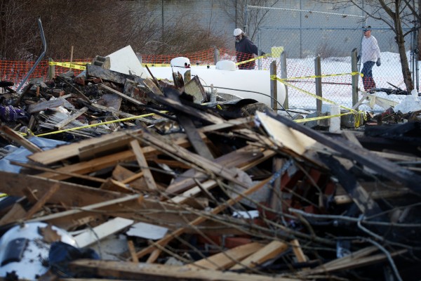 Workmen erect a fence around the remains of Bluff Road duplex in Bath Wednesday, Feb. 13, 2013, which burned after a propane leak and explosion killing neighbor Dale Ann Fussell, 64, Tuesday morning. Workmen erect a fence around the remains of Bluff Road duplex in Bath Wednesday, Feb. 13, 2013, which burned after a propane leak and explosion killing neighbor Dale Ann Fussell, 64, Tuesday morning.