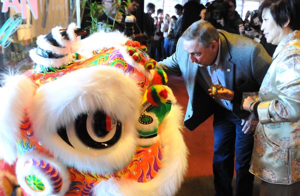 Gov. Paul LePage brushes the eye of the lion to awaken it during a ceremony marking the Chinese New Year Sunday. According to Chinese tradition, the awakened lion chases away the evil spirits. The celebration was hosted at the Oriental Jade restaurant in Bangor. On the right is Lilian Lo, the co-owner of Oriental Jade. Gov. Paul LePage brushes the eye of the lion to awaken it during a ceremony marking the Chinese New Year Sunday. According to Chinese tradition, the awakened lion chases away the evil spirits. The celebration was hosted at the Oriental Jade restaurant in Bangor. On the right is Lilian Lo, the co-owner of Oriental Jade.