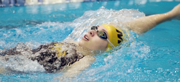 Mount Desert Island's Maggie Painter competes in the 100-yard backstroke during the Class B state meet at the University of Maine's Wallace Pool in Orono Tuesday night. She finished with a time of 1 minutes, 10.16 seconds. Mount Desert Island's Maggie Painter competes in the 100-yard backstroke during the Class B state meet at the University of Maine's Wallace Pool in Orono Tuesday night. She finished with a time of 1 minutes, 10.16 seconds.