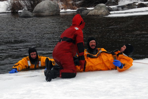 Passadumkeag Fire Department firefighter Nicholas Rossignol and Lowell Fire Department firefighter Hollis Langley (both far right) were among several firefighters who practiced ice water rescue operations at Cold Stream Pond on Sunday, Feb. 24, 2013. Passadumkeag Fire Department firefighter Nicholas Rossignol and Lowell Fire Department firefighter Hollis Langley (both far right) were among several firefighters who practiced ice water rescue operations at Cold Stream Pond on Sunday, Feb. 24, 2013.
