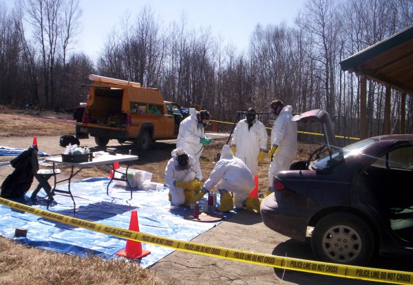 Agents of the Maine Drug Enforcement Agency collect evidence at a suspected methamphetamine lab on Fontaine Drive in Caribou in April 2006. Agents of the Maine Drug Enforcement Agency collect evidence at a suspected methamphetamine lab on Fontaine Drive in Caribou in April 2006.