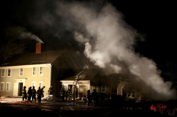 Firefighters from several towns mop up a house fire in Woolwich Tuesday night on the Middle Road. Firefighters from several towns mop up a house fire in Woolwich Tuesday night on the Middle Road.