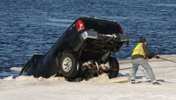 A pick-up truck is removed from the Penobscot River in Passadamkeag after it was found in the water. The driver was reported missing but police were unable to locate him or the vehicle due to the blizzard conditions. The vehicle was located Sunday morning and the driver was found dead. The truck was removed from the river around noon after the body of the driver was taken out by divers. A pick-up truck is removed from the Penobscot River in Passadamkeag after it was found in the water. The driver was reported missing but police were unable to locate him or the vehicle due to the blizzard conditions. The vehicle was located Sunday morning and the driver was found dead. The truck was removed from the river around noon after the body of the driver was taken out by divers.