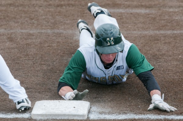 Husson's Benjamin McLain slides back for first base to avoid a tag out during the first game of a doubleheader against the University of Maine-Presque Isle on Saturday, March 23, 2013. Husson's Benjamin McLain slides back for first base to avoid a tag out during the first game of a doubleheader against the University of Maine-Presque Isle on Saturday, March 23, 2013.