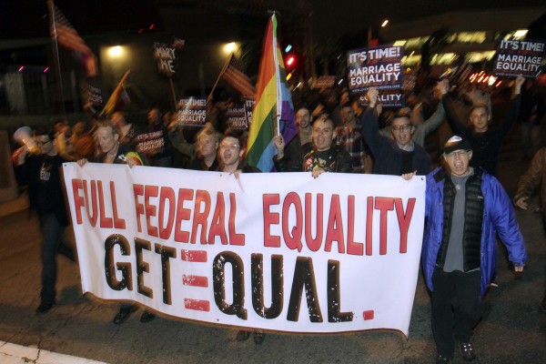 People carry a banner supporting same-sex marriage in California in February 2012. People carry a banner supporting same-sex marriage in California in February 2012.