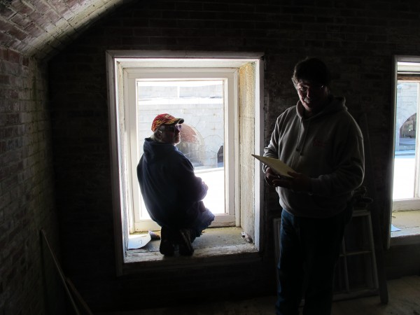 Workers from R.L. White & Son of Hulls Cove work at one of the windows slated for replacement in the Enlisted Men's Quarters at Fort Knox in Prospect, Feb. 26, 2013. Workers from R.L. White & Son of Hulls Cove work at one of the windows slated for replacement in the Enlisted Men's Quarters at Fort Knox in Prospect, Feb. 26, 2013.