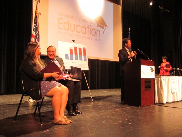 Gov. Paul LePage (center) shares a laugh with Cony High School senior Michelle Zhang at the beginning of LePage's "Putting Students First" education summit in Augusta on Friday, March 22, 2013. Speaking at the podium is Education Commissioner Stephen Bowen. Gov. Paul LePage (center) shares a laugh with Cony High School senior Michelle Zhang at the beginning of LePage's "Putting Students First" education summit in Augusta on Friday, March 22, 2013. Speaking at the podium is Education Commissioner Stephen Bowen.