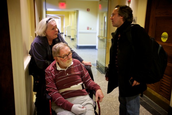 Rep. Ann Peoples, D-Westbrook, talks to Rep. Drew Gattine, D-Westbrook, (right) in hall at the State House in Augusta Friday while her husband Patrick listens. Patrick suffered a stroke just over a year ago and comes to work with her nearly every day. Rep. Ann Peoples, D-Westbrook, talks to Rep. Drew Gattine, D-Westbrook, (right) in hall at the State House in Augusta Friday while her husband Patrick listens. Patrick suffered a stroke just over a year ago and comes to work with her nearly every day.