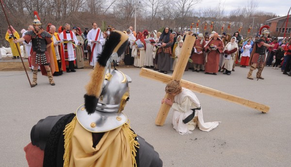 Jesus falls for the first time at the third station of the cross during the Way of the Cross procession organized by area Catholic parishes. The procession started at St. Joseph's Catholic Church in Brewer and participants walked about two mile to St. John's Catholic Church in Bangor. Portraying Jesus in the procession is Justin Vroom. Jesus falls for the first time at the third station of the cross during the Way of the Cross procession organized by area Catholic parishes. The procession started at St. Joseph's Catholic Church in Brewer and participants walked about two mile to St. John's Catholic Church in Bangor. Portraying Jesus in the procession is Justin Vroom.