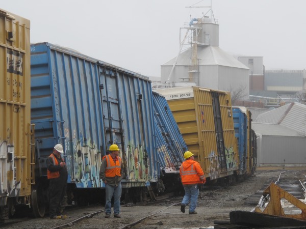 Several Pan Am Railways employees arrived with heavy machinery at the scene of the derailment on Wednesday morning. Several Pan Am Railways employees arrived with heavy machinery at the scene of the derailment on Wednesday morning.