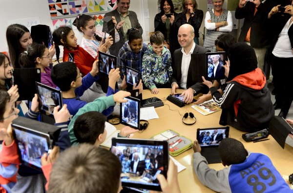 Fifth graders use their iPads to take photos of Sweden's Prime Minister Fredrik Reinfeldt (center) during his visit to Husby School, west of Stockholm, November 21, 2012. Fifth graders use their iPads to take photos of Sweden's Prime Minister Fredrik Reinfeldt (center) during his visit to Husby School, west of Stockholm, November 21, 2012.