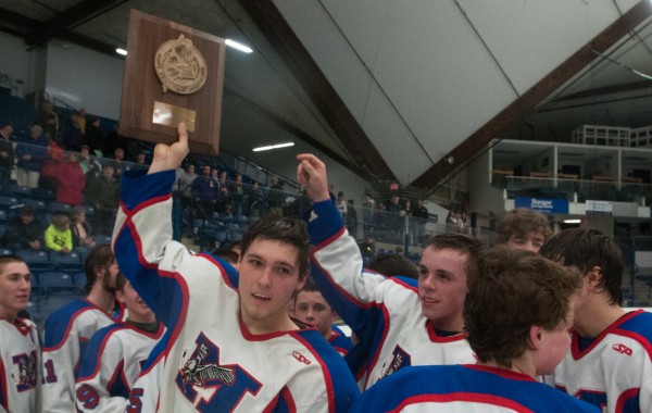 Messalonskee defenseman Kalib Bernatchez holds up the Eastern Maine Class B championship plaque after defeating John Bapst at Alfond Arena at the University of Maine in Orono on Tuesday, March 5, 2013. Messalonskee defenseman Kalib Bernatchez holds up the Eastern Maine Class B championship plaque after defeating John Bapst at Alfond Arena at the University of Maine in Orono on Tuesday, March 5, 2013.