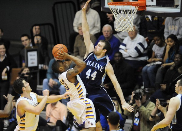 UMaine's Mike Allison defends against Albany's Mike Black in the second half of an America East quarterfinal from SEFCU Arena Saturday night. Albany came from behind to defeat Maine 50-49. UMaine's Mike Allison defends against Albany's Mike Black in the second half of an America East quarterfinal from SEFCU Arena Saturday night. Albany came from behind to defeat Maine 50-49.