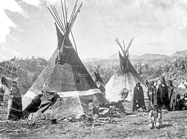 Shoshone Indians stand amidst the skin teepees (or "lodges") they have erected at a camp somewhere in the Rockie Mountains circa 1860-1870. William Farnham of Bangor marched with California infantrymen in late January 1863 to attack a similar Shoshone camp along the Bear River in Washington Territory. In a letter to his parents, Farnham compared the battle to fighting Confederate troops back east. Shoshone Indians stand amidst the skin teepees (or "lodges") they have erected at a camp somewhere in the Rockie Mountains circa 1860-1870. William Farnham of Bangor marched with California infantrymen in late January 1863 to attack a similar Shoshone camp along the Bear River in Washington Territory. In a letter to his parents, Farnham compared the battle to fighting Confederate troops back east.