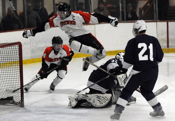 Brewer’s Spencer Valley leaps over Hampden goalie Ryan Manning during a game on Dec. 12 in Brewer after Manning trapped his shot on goal. Also in on the action was Brewer’s Gabe Valley (4) and Hampden’s Joshua Kocik (21). Spencer Valley has been named a co-player of the Year in Eastern Maine Class B. Brewer’s Spencer Valley leaps over Hampden goalie Ryan Manning during a game on Dec. 12 in Brewer after Manning trapped his shot on goal. Also in on the action was Brewer’s Gabe Valley (4) and Hampden’s Joshua Kocik (21). Spencer Valley has been named a co-player of the Year in Eastern Maine Class B.