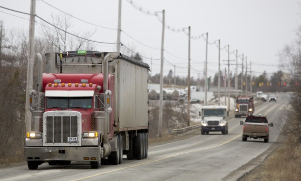 Trucks drive down Odlin Road Wednesday afternoon in Hermon. Hermon Town Manager Roger Raymond says that Hermon stands to become the hardest-hit town in Maine by Gov. LePage's excise tax plan. Trucks drive down Odlin Road Wednesday afternoon in Hermon. Hermon Town Manager Roger Raymond says that Hermon stands to become the hardest-hit town in Maine by Gov. LePage's excise tax plan.