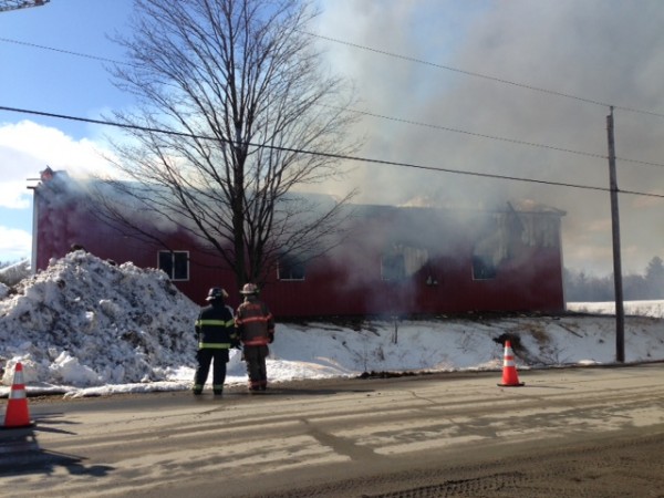 Fire crews fight a barn blaze in Corinna Thursday, March 21, 2013. Fire crews fight a barn blaze in Corinna Thursday, March 21, 2013.