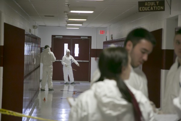 Husson University criminal justice students collect evidence at Orono High School after a live shooter drill held by Orono fire and police departments on Saturday. Husson University criminal justice students collect evidence at Orono High School after a live shooter drill held by Orono fire and police departments on Saturday.