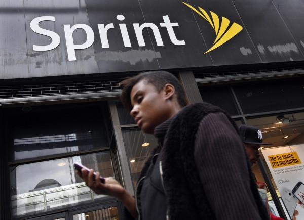 A woman walks past a Sprint store in New York's financial district in this file photo taken October 15, 2012. Dish Network Corp., the No. 2 U.S. satellite television provider, offered to buy Sprint Nextel Corp. for $25.5 billion in cash and stock, a move that could thwart the proposed acquisition of Sprint by Japan's SoftBank Corp. A woman walks past a Sprint store in New York's financial district in this file photo taken October 15, 2012. Dish Network Corp., the No. 2 U.S. satellite television provider, offered to buy Sprint Nextel Corp. for $25.5 billion in cash and stock, a move that could thwart the proposed acquisition of Sprint by Japan's SoftBank Corp.