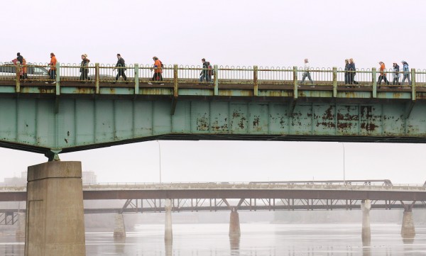 Participants in the 2013 Hike for the Homeless cross the Joshua Chamberlain Bridge as they walk to the Bangor Waterfront Saturday. The 18th annual event is intended to raise awareness and money for the Bangor Area Homeless Shelter. About 770 people from several surrounding communities hiked to the waterfront and raised about $27,000. Participants in the 2013 Hike for the Homeless cross the Joshua Chamberlain Bridge as they walk to the Bangor Waterfront Saturday. The 18th annual event is intended to raise awareness and money for the Bangor Area Homeless Shelter. About 770 people from several surrounding communities hiked to the waterfront and raised about $27,000.