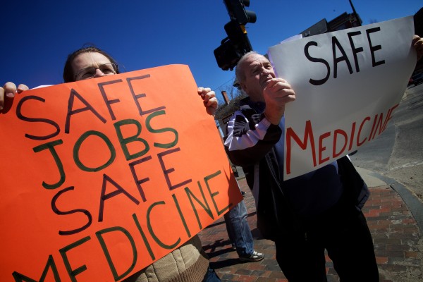 Ben Collings (left) and Wayne Poland take part in a demonstration in Portland on Saturday morning supporting unionizing efforts at Wellness Connection of Maine, a medical marijuana dispensary. Ben Collings (left) and Wayne Poland take part in a demonstration in Portland on Saturday morning supporting unionizing efforts at Wellness Connection of Maine, a medical marijuana dispensary.