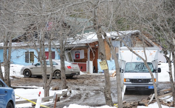 State Police cars and evidence vehicles sit on the property of Lawrence Lewis at 450 Molunkus Road in Molunkus on Tuesday. Lewis was found dead inside his home shortly after Bruce King held police at bay with a gun to his head on Monday, March 11, 2013 along Interstate 95 near Lincoln. State Police cars and evidence vehicles sit on the property of Lawrence Lewis at 450 Molunkus Road in Molunkus on Tuesday. Lewis was found dead inside his home shortly after Bruce King held police at bay with a gun to his head on Monday, March 11, 2013 along Interstate 95 near Lincoln.
