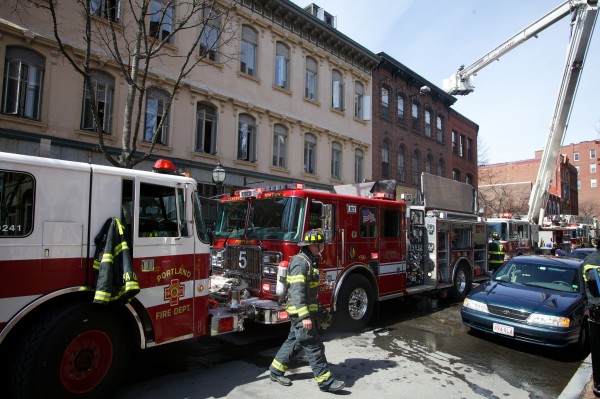 Portland firefighters respond to a two-alarm fire at 86 Exchange St. in the city's Old Port Monday morning. The fire is believed to have started in the basement. Portland firefighters respond to a two-alarm fire at 86 Exchange St. in the city's Old Port Monday morning. The fire is believed to have started in the basement.