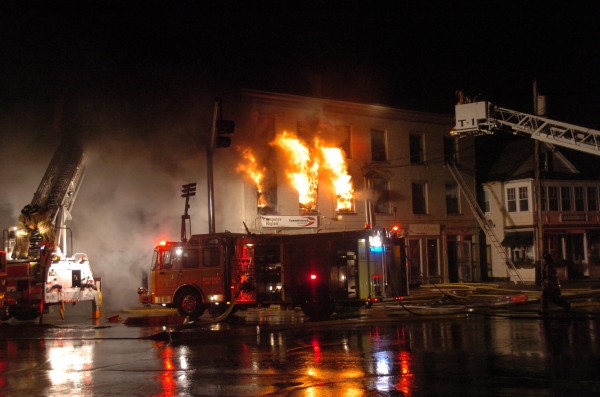 Flames tear through the second floor of the building at the corner of Mason and Maine streets in the early morning hours of April 17, 2011. Flames tear through the second floor of the building at the corner of Mason and Maine streets in the early morning hours of April 17, 2011.
