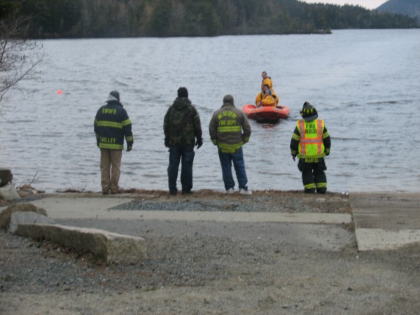 Searchers return to the boat launch at the northern end of Long Pond on Mount Desert Island on Thursday, April 18, 2013, after trying to find Corey Farley, 38, of Tremont. Searchers return to the boat launch at the northern end of Long Pond on Mount Desert Island on Thursday, April 18, 2013, after trying to find Corey Farley, 38, of Tremont.