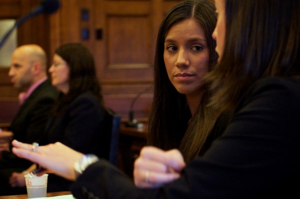 Alexis S. Wright, 29, of Wells listens to her attorney, Sarah Churchill in Cumberland County Superior Court Tuesday Oct. 9, 2012 where she was arraigned on 106 criminal charges. Alexis S. Wright, 29, of Wells listens to her attorney, Sarah Churchill in Cumberland County Superior Court Tuesday Oct. 9, 2012 where she was arraigned on 106 criminal charges.
