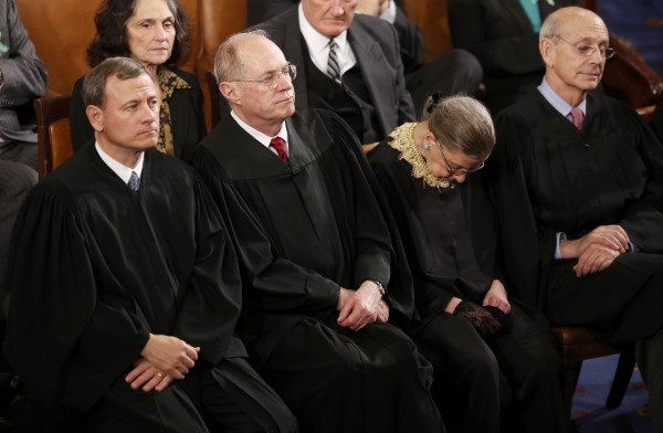 U.S. Supreme Court Chief Justice John Roberts, left, and Associate Justices Anthony Kennedy, Ruth Bader Ginsburg and Stephen Breyer listen as U.S. President Barack Obama delivers his State of the Union speech on Capitol Hill in Washington, February 12, 2013. U.S. Supreme Court Chief Justice John Roberts, left, and Associate Justices Anthony Kennedy, Ruth Bader Ginsburg and Stephen Breyer listen as U.S. President Barack Obama delivers his State of the Union speech on Capitol Hill in Washington, February 12, 2013.