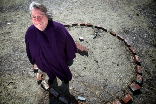 Rev. Sylvia Stocker stands in a circle of bricks on the vacant lot where her church used to stand. The bricks are all that's left of the Universalist Unitarian Church of Brunswick but her congregation will soon get a new building. Rev. Sylvia Stocker stands in a circle of bricks on the vacant lot where her church used to stand. The bricks are all that's left of the Universalist Unitarian Church of Brunswick but her congregation will soon get a new building.