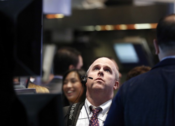 Traders work on the floor at the New York Stock Exchange, April 30, 2013. Traders work on the floor at the New York Stock Exchange, April 30, 2013.
