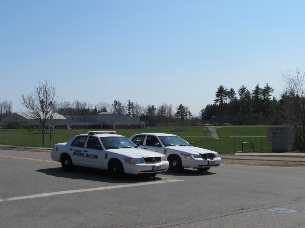 Police cars block the driveway at Gorham Middle School Friday just after 3 p.m. An officer on duty said investigators are responding to a bomb scare at the location, and no students remained in the building at that time. Police cars block the driveway at Gorham Middle School Friday just after 3 p.m. An officer on duty said investigators are responding to a bomb scare at the location, and no students remained in the building at that time.