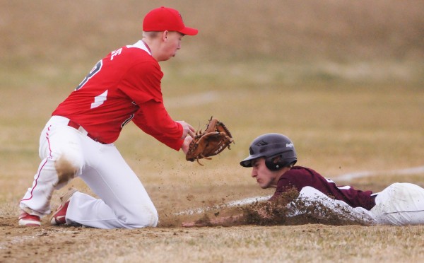 Foxcroft Academy's Cameron Fadley slides into third as Dexter's Matt Crane attempts to tag him out during fifth inning action at Dover Foxcroft on Thursday. Fadley was ruled safe. Foxcroft Academy's Cameron Fadley slides into third as Dexter's Matt Crane attempts to tag him out during fifth inning action at Dover Foxcroft on Thursday. Fadley was ruled safe.