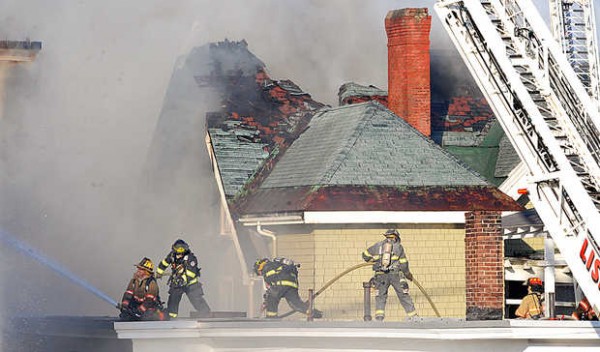 Firefighters from multiple departments battle a four alarm fire in downtown Lewiston Monday. At least four apartment buildings on Bates, Blake and Pine Streets were involved, with many more in peril. Firefighters from multiple departments battle a four alarm fire in downtown Lewiston Monday. At least four apartment buildings on Bates, Blake and Pine Streets were involved, with many more in peril.