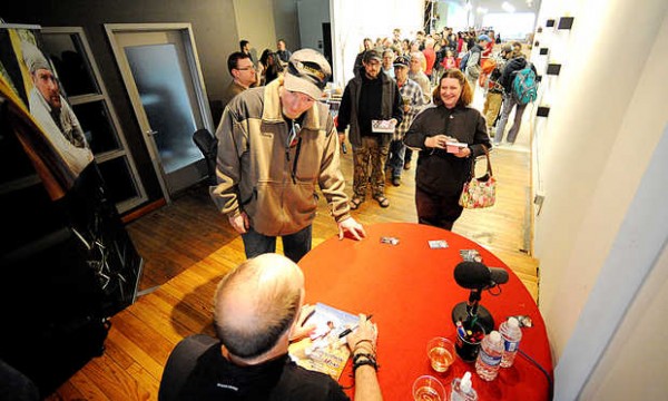 A long line of fans stretches behind Rocky Thompson and his fiancee, Rebecca Smullen, both of Conway, N.H., as they get an autograph from survival expert and musician Les Stroud on Thursday at Prose Gallery in Lewiston during the kickoff to the Lewiston Auburn Film Festival. Stroud's television show, "Survivorman," is aired on the Science and Discovery cable channels. A long line of fans stretches behind Rocky Thompson and his fiancee, Rebecca Smullen, both of Conway, N.H., as they get an autograph from survival expert and musician Les Stroud on Thursday at Prose Gallery in Lewiston during the kickoff to the Lewiston Auburn Film Festival. Stroud's television show, "Survivorman," is aired on the Science and Discovery cable channels.