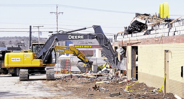 An excavator and heavy equipment operator from Hughes Bros Inc. tear out sections of the Hogan Road McDonald's in Bangor on Friday, April 5. The restaurant is being torn down to provide space for a new, modern McDonald's. Plans call for the new restaurant to be open in 90 days. An excavator and heavy equipment operator from Hughes Bros Inc. tear out sections of the Hogan Road McDonald's in Bangor on Friday, April 5. The restaurant is being torn down to provide space for a new, modern McDonald's. Plans call for the new restaurant to be open in 90 days.