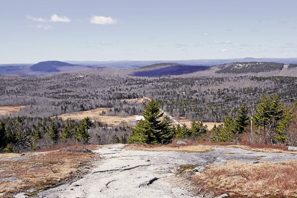 From the access trail that ascends Bald Mountain in Dedham, the view to the southwest encompasses nearby Great Pond Mountain in Orland (left), the Camden Hills on the distant horizon (center). and Dodge Hill (right). From the access trail that ascends Bald Mountain in Dedham, the view to the southwest encompasses nearby Great Pond Mountain in Orland (left), the Camden Hills on the distant horizon (center). and Dodge Hill (right).