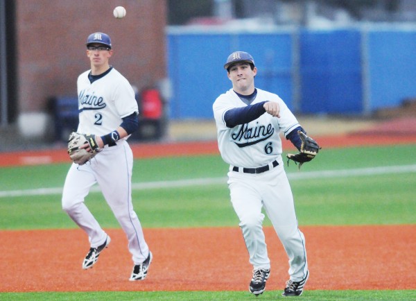 UMaine infielder Eric White throws to first for an out against Thomas College during third inning action on Tuesday at Orono. UMaine infielder Eric White throws to first for an out against Thomas College during third inning action on Tuesday at Orono.
