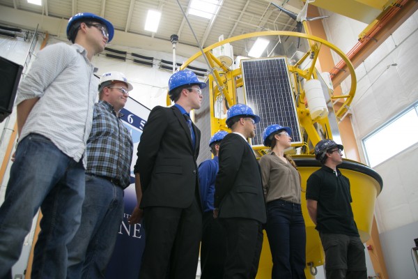 Students at the University of Maine Advanced Structures and Composites Center gathered for the unveiling of a floating buoy LIDAR system. The system uses lasers to test high altitude wind speeds over oceans for wind turbine development. The buoy will measure wind speeds in the gulf of Maine for the first time. Students at the University of Maine Advanced Structures and Composites Center gathered for the unveiling of a floating buoy LIDAR system. The system uses lasers to test high altitude wind speeds over oceans for wind turbine development. The buoy will measure wind speeds in the gulf of Maine for the first time.