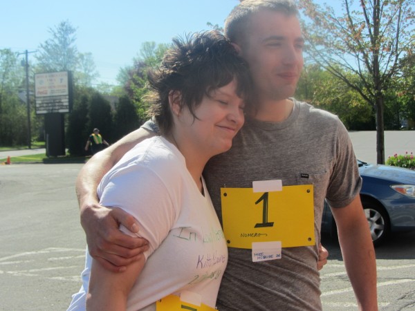 Kaitlyn and Mike McGuire hug as they sign up for a road race to raise awareness about bullying. Kaitlyn and Mike McGuire hug as they sign up for a road race to raise awareness about bullying.